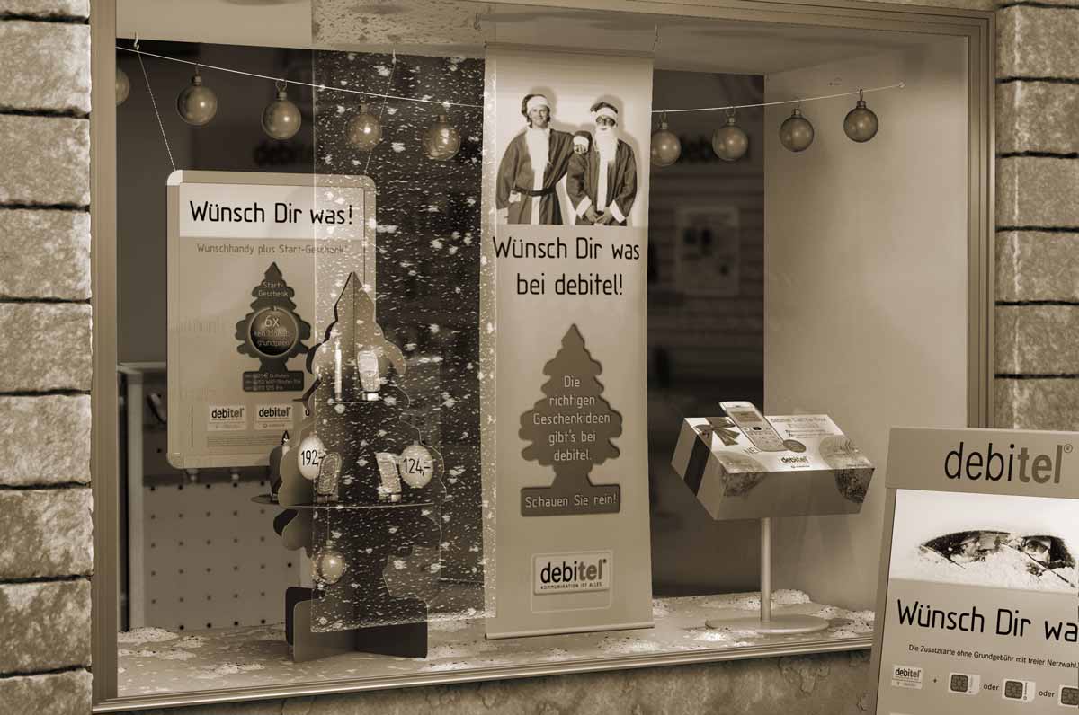 Illustration Debitel Muster-Schaufenster mit Weihnachts-Auslage (©2002 hasche.mediendesign)